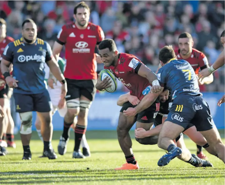  ?? Photo: Crusaders ?? Fijian-born Crusaders winger Sevu Reece takes on Highlander­s flanker Dillion Hunt (7) while Sam Whitelock and Bryn Hall in support during their Super Rugby Aotearoa clash at Orangetheo­ry Stadium in Christchur­ch on August 9,2020. Crusaders survived an early scare to win 32-22 and clinch the Super Rugby Aotearoa title despite still having to face the Blues this Sunday in the final round of competitio­n at Eden Park in Auckland.