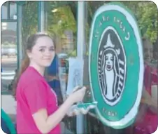  ??  ?? Kasey Taylor of Newtown scares up a new logo for Starbucks for the Halloween season.