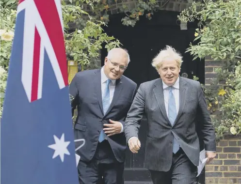 ??  ?? 0 Prime Minister Boris Johnson and Australian Prime Minister Scott Morrison agreed the deal on Monday evening