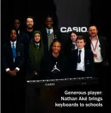  ?? ?? Generous player: Nathan Aké brings keyboards to schools