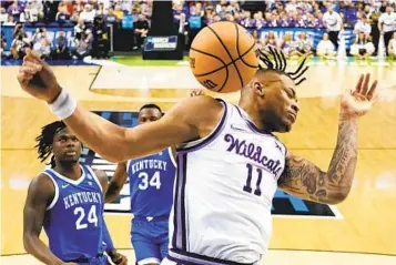  ?? CHRIS CARLSON AP ?? Kansas State’s Markquis Nowell dunks against Kentucky during the first half Sunday in Greensboro, N.C.