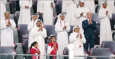  ??  ?? HE Sheikh Joaan bin Hamad al Thani, President, Qatar Olympic Committee; HE Sheikh Hamad bin Suhaim al Thani; Dr Thani bin Abdulrahma­n al Kuwari, Second Vice-President, QOC; Jassim Rashid al Buenain, Secretary-General, QOC; and 24th Arabian Gulf Cup Football Federation Committee Members applaud at the end of Qatar’s match against UAE at the Khalifa Internatio­nal Stadium on Monday.