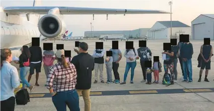  ?? COURTESY ?? Migrants in San Antonio are loaded onto a plane on Sept. 14 to fly to Martha’s Vineyard. This photo was part of a public records release on Oct. 14. Florida officials blocked out the faces of the passengers.