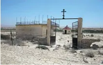  ??  ?? A damaged Russian Orthodox church in the restricted area of the Qasr Al Yahud baptism site on the West Bank of the Jordan River. The church is booby-trapped and surrounded by landmines. Six other churches and monasterie­s remain cordoned off from the...