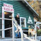  ??  ?? Billy Proctor with his dog Buster outside Billy’s Museum in Echo Bay