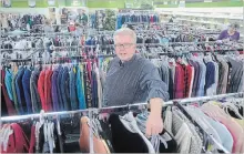  ?? DAVID BEBEE WATERLOO REGION RECORD ?? Ken Cullen is manager of Bibles for Missions store in Kitchener. The three-level thrift store is moving from Scott Street in downtown Kitchener to the former location of Steve's TV in the Frederick Mall.