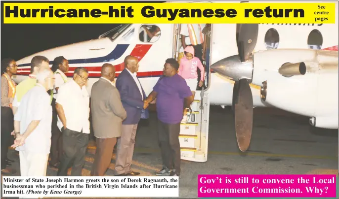  ?? (Photo by Keno George) ?? Minister of State Joseph Harmon greets the son of Derek Ragnauth, the businessma­n who perished in the British Virgin Islands after Hurricane Irma hit.