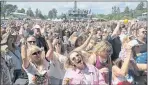  ?? ERIC RISBERG — THE ASSOCIATED PRESS ?? People listen to Michael Franti at the BottleRock Napa music festival on May 26, 2018. People going this year will need proof of a vaccinatio­n.