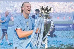  ?? AFP ?? Manchester City’s Erling Haaland poses with the Premier League trophy.