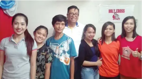  ?? ELY ACAS ?? RUNNER-UP. The Holy Cross of Davao College (HCDC) women's chess team players and coach, which placed second in the Mindanao Peace Games 2016, pose with their sports director Rudy Salvador.