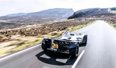  ??  ?? The sunlit uplands of the Isle of Man in a British-built car. To the future!