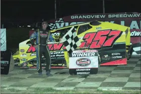  ?? RICH KEPNER - FOR MEDIANEWS GROUP ?? Duane Howard poses in victory lane after his modified win at Grandview on July 27.