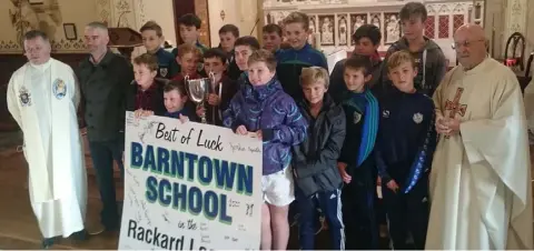  ??  ?? The Barntown Rackard League winners with their cup at Sunday Mass in Barntown.