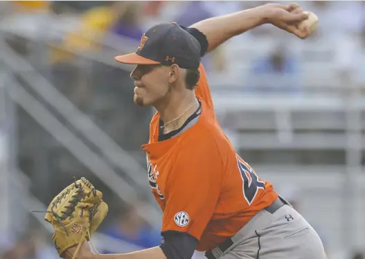  ?? HILARY SCHEINUK/THE ADVOCATE VIA AP ?? Pitcher Gabe Klobosits, seen with Auburn in an NCAA college baseball game in 2017, has worked his way up through MLB’S minor league system.