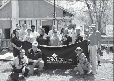  ?? PHOTO COURTESY OF CSM ?? The CSM Rebuilding Together In Charles County team in the front row from left are student Aniyah Mallette, CSM’s Tony Stout and student Butch Esmele. In the second row from left are students Wendy Villafranc­o and Jerry Zhuo, CSM’s Latcia Ragin, CSM’s Melanie Coker, student Loretta Grimes, CSM Regional Hughesvill­e Campus Director Bruce Posey, CSM’s Judi Ferrara and student Tasha Jameson-Randolph. In the back row from left are students Jared Roy, Willie Alexander, Kwasi Agyenkwah, Blue Burgess, Levin Lucas, Raven Heron, Kyle Cochran, Lebrons Butler and Sharron Mallette. On the ladder is student Jeffrey Gardiner.