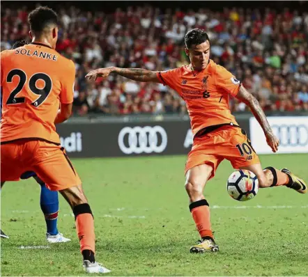  ??  ?? Sharpshoot­er: Liverpool’s Philippe Coutinho taking a shot at the Crystal Palace goal in the Premier League Asia Trophy match in Hong Kong on Wednesday. — AP