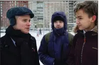  ?? AP ?? Leonid Shaidurov (from left) talks with Maxim Dautov and Andrei Vorsin outside their high school in St. Petersburg, Russia, last week. Shaidurov and Dautov are among Russia’s newest student activists, using social media to air a dispute with their principal.