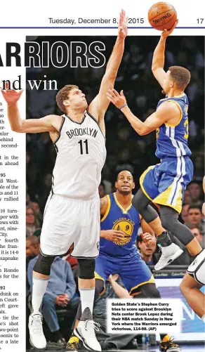  ??  ?? Golden State’s Stephen Curry tries to score against Brooklyn Nets center Brook Lopez during their NBA match Sunday in New York where the Warriors emerged victorious, 114-98. (AP)