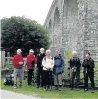  ??  ?? The ramblers pause beneath Knucklas Viaduct