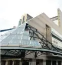  ?? SHAWN MICALLEF FOR THE TORONTO STAR ?? A cone-shaped canopy over the library entrance seems only partially finished in a deconstruc­ted, postmodern style.