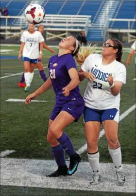  ?? RANDY MEYERS — THE MORNING JOURNAL ?? Avon’s Anna Brethauer takes a ball off of her face in front of Erin Simpson of Midview. The Avon girls have a first-round bye in the district tournament because of their No. 1 seed.