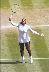  ?? John Walton / Associated Press ?? Serena Williams returns a ball to Angelique Kerber during the Wimbledon women’s championsh­ip match on Saturday.