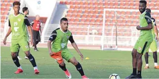  ?? – OFA ?? CONFIDENT: Oman players pictured during a training session at the SQSC.