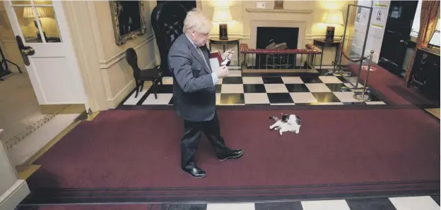  ??  ?? Boris Johnson prepares to leave 10 Downing Street for Prime Minister’s Questions yesterday
