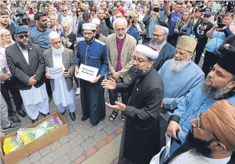  ??  ?? Members of the British Muslim Forum and Christian and Jewish religious leaders at St Ann’s Square in Manchester.