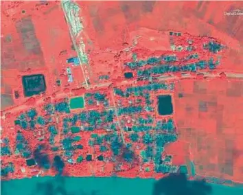  ?? AP ?? This May 26, 2017, colour infrared satellite image released by DigitalGlo­be shows an aerial overview of the decimated village of Gu Dar Pyin, Myanmar.