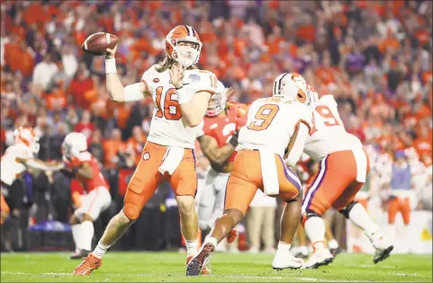  ?? Christian Petersen / TNS ?? Clemson quarterbac­k Trevor Lawrence drops back to pass against Ohio State during the PlayStatio­n Fiesta Bowl at State Farm Stadium in December in Glendale, Ariz.