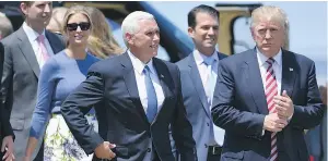  ?? — GETTY IMAGES ?? Donald Trump, the Republican nominee for president of the United States, and running mate Mike Pence arrive at the Great Lakes Science Center in Cleveland on Wednesday.