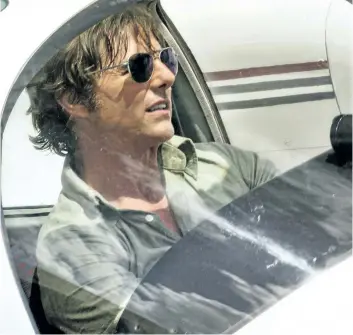  ?? DAVID JAMES/UNIVERSAL PICTURES ?? This image released by Universal Pictures shows Tom Cruise as Barry Seal in a scene from American Made.