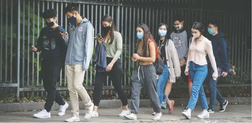  ?? PETER J THOMPSON / NATIONAL POST ?? Public health rules including the mandatory wearing of masks has not stemmed the recent uptick in coronaviru­s cases.