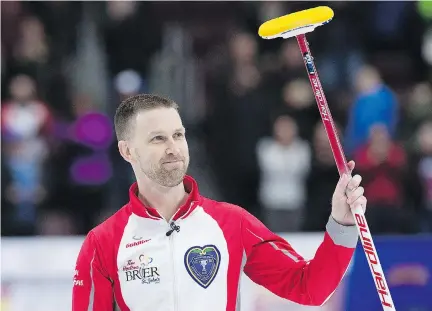  ?? ANDREW VAUGHAN/THE CANADIAN PRESS ?? Newfoundla­nd and Labrador skip Brad Gushue acknowledg­es the cheers of the crowd in St. John’s on Friday at the Tim Hortons Brier after defeating Mike McEwen of Manitoba 7-5 in the Page 1-2 game to earn a berth in Sunday’s championsh­ip final.