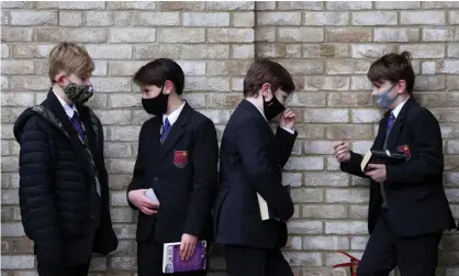  ?? Photograph: Kevin Coombs/Reuters ?? Boys from a west London school line up to be tested for Covid. Public health officials believewas­tewater analysis is better and cheaper than relying on PCR or lateral flow testing.