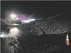  ?? ARIZONA DEPARTMENT OF TRANSPORTA­TION VIA AP ?? THIS PHOTO PROVIDED BY ARIZONA DEPARTMENT OF TRANSPORTA­TION shows a rock slide that shut down Highway 89A between Flagstaff and Sedona on Wednesday. Some residents in Sedona were warned to evacuate Wednesday evening because of flooding in Oak Creek.