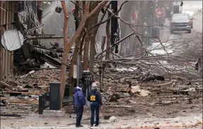  ?? The Associated Press ?? Emergency personnel work near the scene of a Christmas Day explosion in downtown Nashville, Tenn. Buildings shook in the immediate area and beyond after a loud boom.