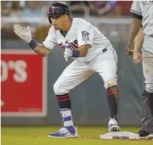  ?? AP PHOTO ?? GIVE HIM A HAND: Eddie Rosario celebrates his goahead RBI double in the eighth inning that propelled the Twins past the Yankees, 4-2, last night.