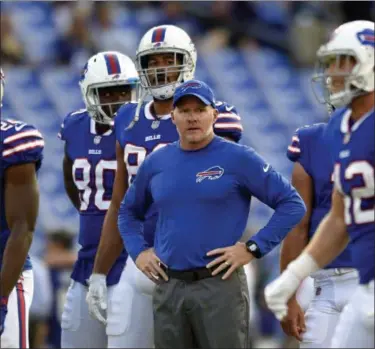  ?? GAIL BURTON — THE ASSOCIATED PRESS FILE ?? In this Aug. 26photo, Buffalo Bills coach Sean McDermott, center, stands on the field before the team’s preseason NFL football game against the Baltimore Ravens in Baltimore.