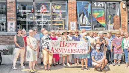  ?? CONTRIBUTE­D ?? Founder Cheryl Lamerson (second from left, front row) joined with volunteers and supporters of Lunenburg Community Consignmen­t’s 10th anniversar­y on Aug. 15.