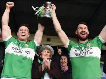  ??  ?? Legion joint Captains Damien O’Sullivan and Padraig Lucey lift the O’Donoghue Cup after receiving it from Eilee, Finola and Maura with (left) Johnny Brosnan Chairman East Kerry Board and (right) Patrick O’Donoghue Man.Director Gleneagle Hpotel sponsors at the East Kerry O’Donoghue Cup final in Fitzgerald Stadium, Killarney on Sunday Photo by Michelle Cooper Galvin