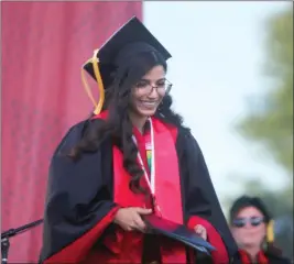 ?? RICK SILVA — PARADISE POST ?? Belinda Espinosa walks off the stage Friday at Chico State in Chico after she graduated from the College of Agricultur­e.