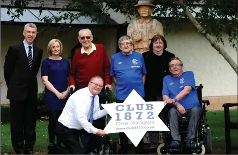  ??  ?? Members of Club 1872 present the Rangers season tickets to Erskine residents