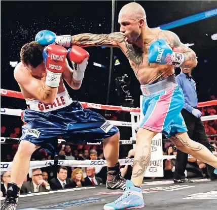  ?? FILE ?? In this June 6, 2015 file photo, Miguel Cotto (right) of Puerto Rico punches Daniel Geale, of Australia, during the second round of a boxing match in New York.