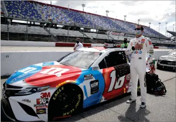  ?? AP PHOTO BY BRYNN ANDERSON ?? Kyle Busch stands for the playing of the national anthem before the start of the NASCAR Cup Series auto race Sunday, May 17, 2020, in Darlington, S.C.