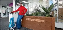  ?? MARTIN DE RUYTER ?? Brenda Kenny sits on one of the new planter boxes outside Farmers in Trafalgar St. Lewis Stanton previously slept on the footpath at the location.