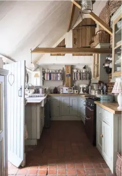  ??  ?? THIS PAGE Although the kitchen is quite small, taking down the false ceiling opened up the space; vintage pieces from local fairs decorate the farmhouse, while lace and broderie anglaise make decorative trimmings on the dresser shelves; Caroline...