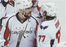  ?? AP PHOTO ?? STAYING ALIVE: T.J. Oshie (77) celebrates his first-period goal with Alex Ovechkin that helped the Capitals to a 5-2 victory to force a deciding Game 7 tomorrow.