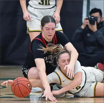  ?? Justin Guido/ For the Post- Gazette photos ?? Blackhawk’s Haley Romigh, right, goes for a loose ball against Fairview’s Breanna Heidt Saturday in a PIAA Class 3A quarterfin­al at Slippery Rock University.
